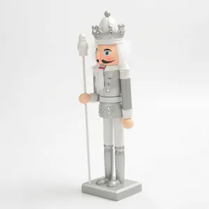 Side view of a 30cm silver and white decorative Christmas nutcracker soldier figurine.