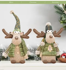Two Christmas reindeer plush dolls with green hats and vests for holiday home decor