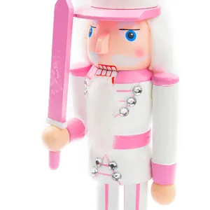Macro detail of a 38cm pink wooden nutcracker soldier ornament for festive home decor