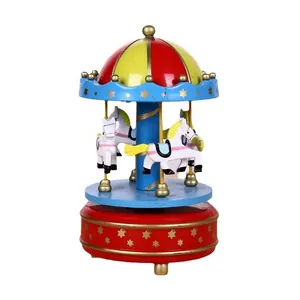 Vintage wind-up wooden carousel music box in red and blue with stars for holiday gift