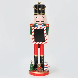 Close-up of a 38cm Christmas wooden nutcracker soldier holding a mini photo frame