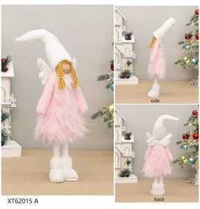 Detailed views of pink fuzzy Christmas angel doll with white wings for holiday decor