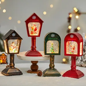 Set of four retro Christmas snow globe lanterns with Santa and snowman scenes