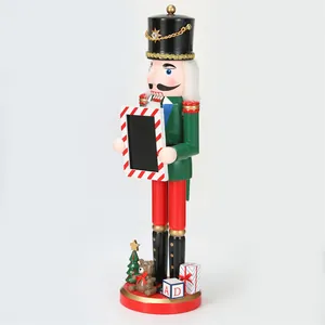 Side view of 38cm wooden Christmas nutcracker soldier holding a mini photo frame