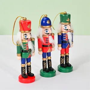 Traditional set of three 12.5cm wooden nutcracker hanging ornaments for Christmas tree decor.