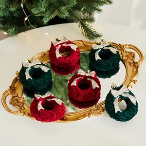 Set of plush Christmas wreath ornaments in burgundy and green with glitter bows for tree decor.
