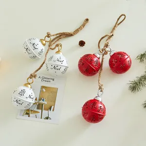 Decorative red and white iron Christmas bell pendants with Noel and Joy cutout designs