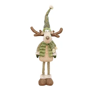 Plush Christmas reindeer figurine with tall green hat and vest, festive holiday decor