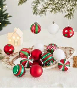 Detailed view of red, white, and green Christmas baubles with various festive patterns