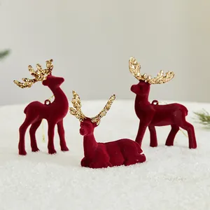 Set de figuras de renos de Navidad flocados en rojo con astas doradas brillantes