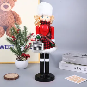 Wooden Christmas nutcracker doll in red plaid outfit with furry hat and bag