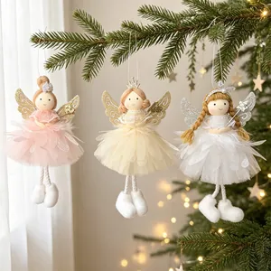 Macro view of three handcrafted fabric Christmas angel dolls with glitter wings on a tree