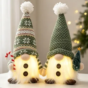 Macro detail of lighted green knitted Christmas gnomes with warm glowing faux fur beards.