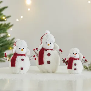 Set of three plush white Christmas snowman figurines with red scarves and hats