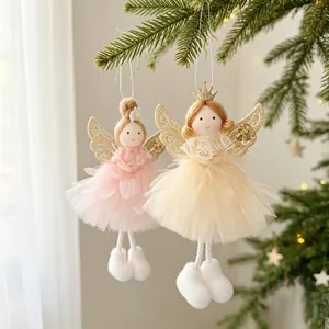 Detailed view of two cute Christmas angel ornaments with glitter wings and tulle skirts.