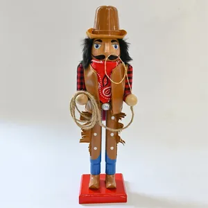 Detailed view of a wooden cowboy nutcracker figurine with lasso and red bandana.