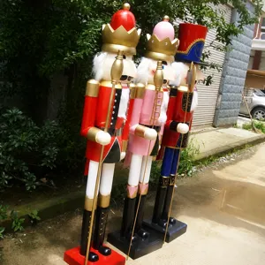 Three large 1.8m wooden nutcracker soldier statues for outdoor Christmas decor.