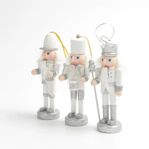 Juego de tres cascanueces de madera blanco y plata con purpurina de 12,5 cm de alto