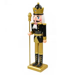 Detailed view of a 38cm black and gold wooden nutcracker soldier decorative ornament