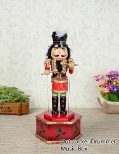 Detail of a 32cm vintage wooden drummer nutcracker wind-up mechanical music box