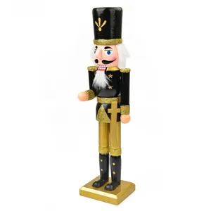 Detailed side view of a 38cm wooden nutcracker soldier figurine in black and gold