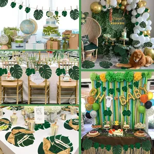 Variety of artificial Monstera leaves used in jungle themed party table decorations