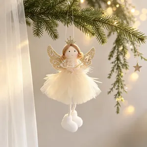 Close-up of a Christmas angel ornament with glitter wings and feather tutu on a tree