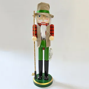 Detailed view of fisherman nutcracker with fishing rod and checkered shirt decoration