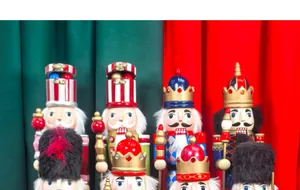 Close-up detail of various classic wooden nutcracker soldiers for Christmas party decor