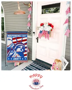 Independence Day garden flag with Statue of Liberty displayed in a festive porch scene