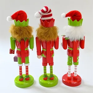 Back view of three 25cm wooden Christmas elf nutcracker figurines for festive table decor