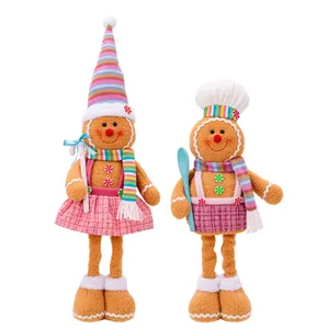 Duo of festive Christmas gingerbread man plush dolls with retractable legs in pink plaid