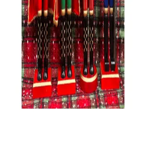Close-up detail showing the red wooden bases and boots of traditional nutcracker soldiers