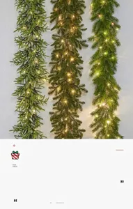 Close-up detail view of three lit Christmas evergreen garlands with warm LED fairy lights