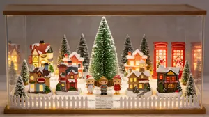 Detailed view of DIY Christmas micro landscape town in a wooden display box
