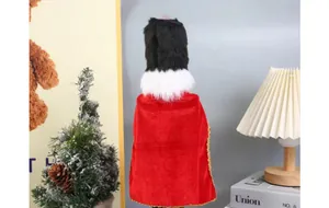 Detailed back view of a 38cm wooden nutcracker featuring a red velvet cape and black fur hat