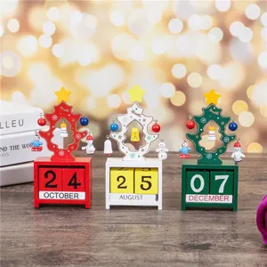 Set of three colorful wooden Christmas tree desk calendars for desktop holiday decoration
