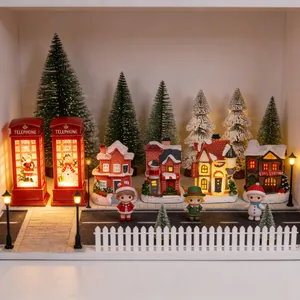Detailed miniature Christmas town micro-landscape DIY scene with glowing houses.