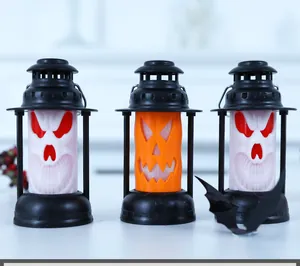 Detailed view of Halloween lanterns with skull and pumpkin face designs for party decor