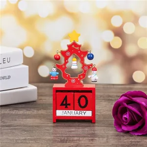 Close-up of red wooden Christmas tree perpetual desk calendar with hanging ornaments