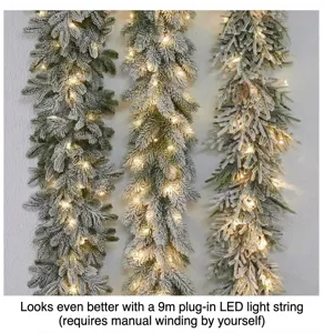 Detail of premium flocked Christmas garland featuring warm white LED lights on wall