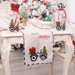 Christmas burlap table runner with red and black tractor design for holiday decor
