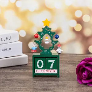Detail view of a handcrafted wooden Christmas tree perpetual calendar desktop ornament.