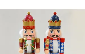 Close-up of two handcrafted 38cm wooden nutcracker soldier puppets for holiday decor
