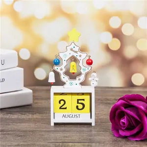Detail of wooden Christmas tree perpetual calendar with yellow number blocks