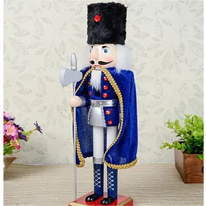 Close-up of a decorative Nutcracker soldier with blue velvet cape and silver axe