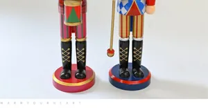Detailed close-up view showing the legs and boots of two 38CM wooden nutcracker puppets
