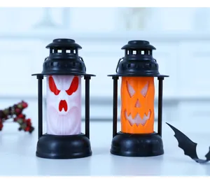 Detail view of decorative Halloween skull and pumpkin lanterns for spooky party decor