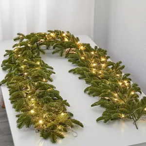 High-quality artificial Christmas garland with warm white LED fairy lights for festive home decor