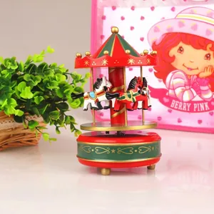 Vintage red and green carousel music box with hand-painted horses and gold accents decor
